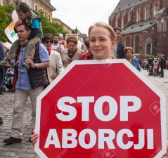 KRAKOW, POLAND - JUNE 1 , 2014 : Rally against abortion in defense of life and family. Inscriptions on a banners : Stop abortion, the right to be born each child etc.